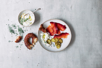 Beetroot cured salmon served with dill, pretzel, gherkins and yogurt sauce