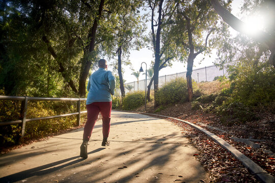 Rear view of man jogging in park