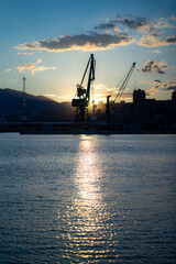 Fototapeta na wymiar industrial port on the Adriatic coast at dusk, early summer