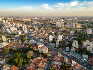 Campinas, Sao Paulo, Brazil. June 23, 2023. Aerial image of three central districts of Campinas: Vila Itapura, Cambuí and Jardim Guanabara. Sunset and blue sky.