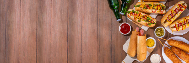 National Hot Dogs day background, hotdog summer party festival foods, Various type of traditional hot dogs - french, corn dog, classic. mexican loaded hotdog, with snack, beer bottles and sauces