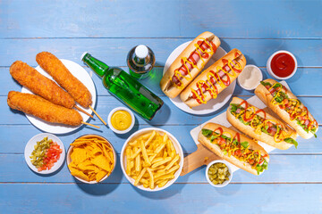 National Hot Dogs day background, hotdog summer party festival foods, Various type of traditional hot dogs - french, corn dog, classic. mexican loaded hotdog, with snack, beer bottles and sauces