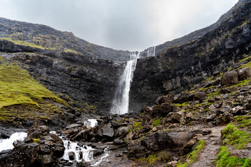 Fototapeta na wymiar A great waterfall in the mountains og the Faroe Islands