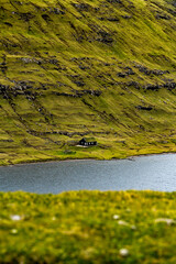 Wooden cabbern on a mountain side in the Faroe Islands