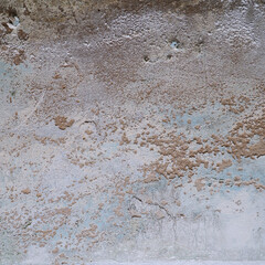 Old dirty cement wall with paint residues