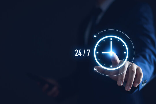nonstop service concept. businessman show virtual 24-7 with clock for worldwide nonstop and full-time available contact of customer service concept. digital online customer service on internet network