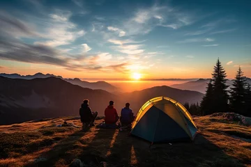 Tuinposter group of friends camping at campsite with tent watching sunrise in mountains,Generative AI © dhiyaeddine