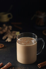 A cup with masala chai in low key