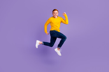 Fototapeta na wymiar Full length profile photo of cheerful man run look empty space isolated on purple color background