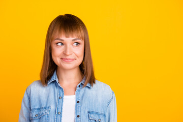 Fototapeta premium Pretty smiling joyfully female with fair hair dressed casually looking with satisfaction at camera isolated against blank studio wall