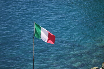 Italy flag with ocean background in Cinque Terre, Italy