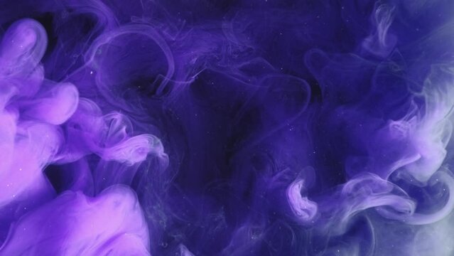 Color smoke. Paint splash. Ink water drop. Storm sky. Blue purple glitter dust particles steam motion on dark abstract art reveal background.