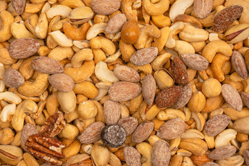 A group of almonds, pistachios, walnuts, macadamia, cashews.