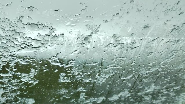 Hail storme on the car window