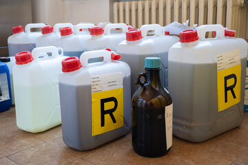 Toxic waste in jerry cans in the chemistry laboratory.