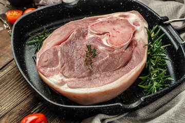 Slices of raw pork knuckle in pan, Culinary cooking. banner, menu, recipe place for text, top view