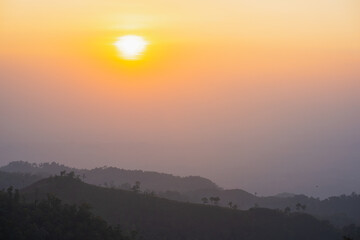 silhouette and panorama layer of mountain with sunset background