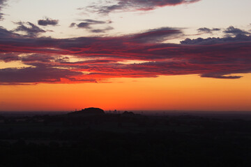 Fototapeta na wymiar Crimson Horizon: Intensely Red Sunrise Captured