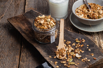 Granola with nuts, raisins and pumpkin seeds in a glass jar