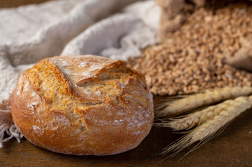 Bakery - Round bread close up. Freshly baked bread with a golden crust.