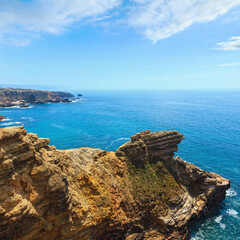 Fototapeta na wymiar Summer Atlantic rocky coast view, Aljezur, Algarve west, Costa Vicentina, Portugal.
