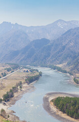 Colorful landscape with mountains, beautiful curving river, green forest.travel, hiking.