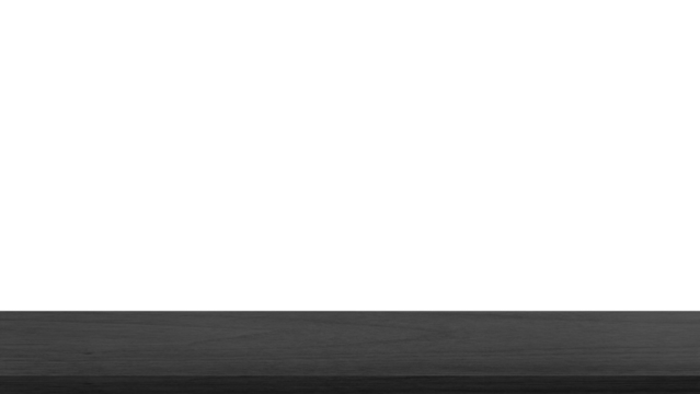empty dark black wooden table top in foreground isolated on background with clipping path. counter bar foreground can be used for display or montage products.