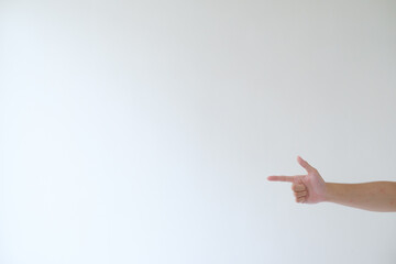 A hand on the right side is pointing to the left side. Isolated white background.
