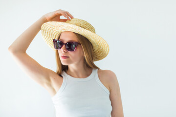 Beauty young woman in hat and sun glasses. Summer travel vacation