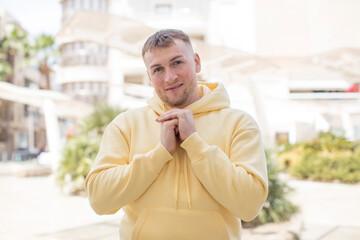 Naklejka premium handsome man happy and excited, surprised and amazed, giggling with a cute expression