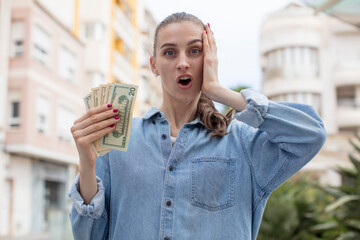 feeling extremely shocked and surprised. dollar banknotes concept