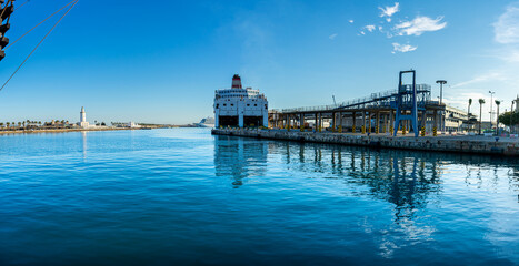Naklejka premium Panoramic view of Malaga port on sunset in Malaga, Spain on January 14, 2023