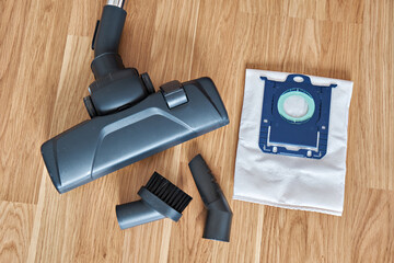 Vacuum cleaner brushes and the trash bag used in it. View from above.