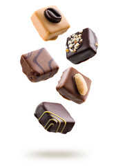 Assorted chocolate pralines floating on white background
