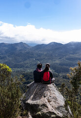 Romantic Getaway in the Paramo: Couple Reveling in the Breathtaking Mountainous Landscape near...