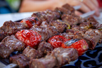 roasted sheep meat with tomatoes in uzbekistan