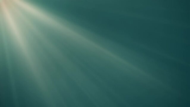 Warm light rays looping animated background on aqua green background