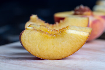 Naklejka na ściany i meble Ripe fresh peaches on a wooden table
