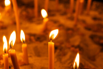 Burning candles in a Catholic Christian church