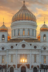 Zoom in on frontal facade of Cathedral of Christ the Saviour with a Sunrays with the sun behind the building during the sunset 