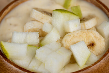 fresh yogurt made from milk with pieces of fresh pears