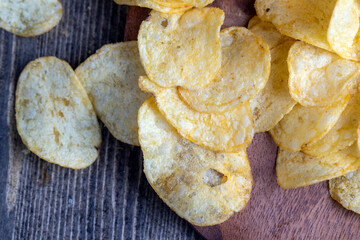 thin potato chips with spices, close up