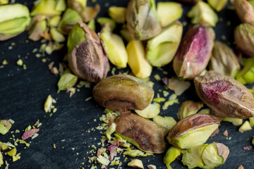 Crispy delicious pistachios with salt on the table