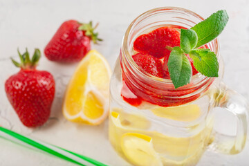 soft drink with lemon, mint and aromatic strawberries
