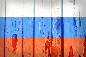 Russia national flag on grunge old wooden background.