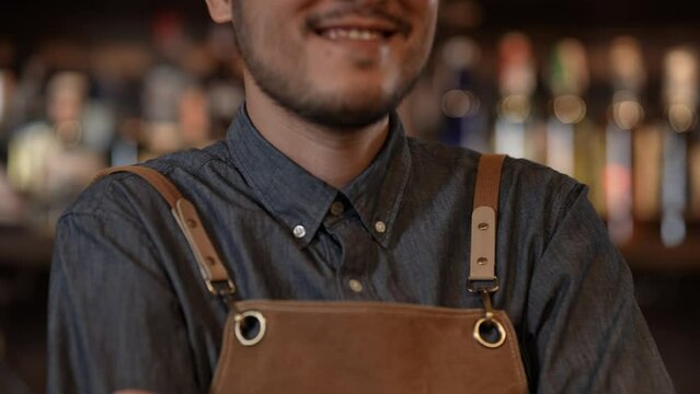Night club concept of 4k Resolution. Asian bartender smiling with confidence in store. A group of specialized clubs that sell alcoholic beverages.