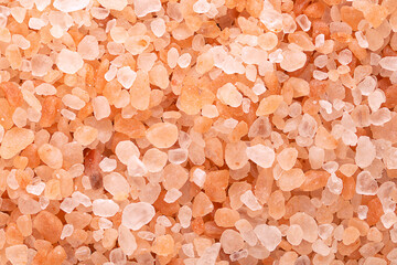Himalayan salt, coarse crystals, macro photo. Rock salt, halite, with a pinkish tint, due to trace...