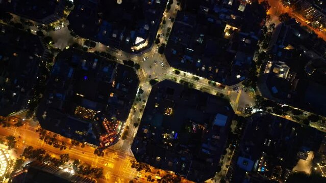 Central areas of Barcelona at night. Top view, filming from a drone.