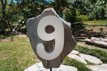 House number address 9 installed on a large rock at the yard of a residence at Costa Rica