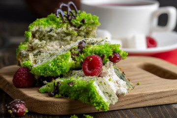 A piece of sweet green cake with berries